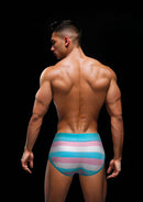 Man wearing Envy Rainbow Pride Briefs in blue with vibrant rainbow pattern, displaying rear view, size M/L, comfortable cotton-spandex blend.