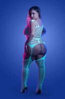 Model wearing Glow-in-the-Dark Timelapse Bodystocking in light blue glow under dark lighting, showcasing unique design and allure.