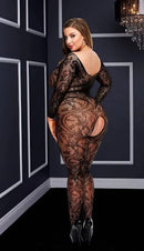Black lace and mesh crotchless bodystocking on a model in an elegant room.