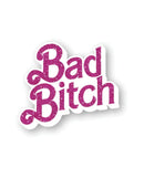 Barbie-inspired "Bad Bitch" enamel pin with pink glitter letters, a cute and fun accessory to showcase confidence and sass.