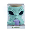 Ceramic teal alien stash jar holding a lavender mug, ideal for 420 parties and storing herbs or spices.