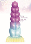 Alien Nation Stardust Dildo with shimmering glitter and unicorn-inspired design against a mystical background