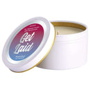 Get Laid Passion Fruit Massage Candle with Pheromones in white tin, open lid, enhances romance and intimacy.