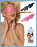 Woman wearing Kinklab padded blindfolds in pink and black, promoting sensory play and comfort.