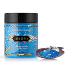 Kama Sutra Treasures of the Sea Bath Salts - Luxurious 24.5 oz jar with oceanic blue salts in a seashell scoop.