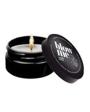 Kama Sutra Blow Me Massage Candle in tin, vanilla crème scent, burning flame, transforms into warm massage oil, 2 oz size.