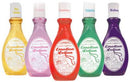 Emotion Lotion bottles in various flavors: Pineapple, Strawberry, Coconut, Apple, and Blueberry for warming massages.