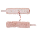 Peaches 'n CreaMe peach-colored faux fur handcuffs with rose gold chain for luxury bondage.