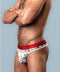 Model wearing Sheer Thong St. Dick & Co L/XL with playful prints and red waistband, showcasing comfort and style.
