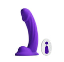 Colours Curve Vibrating Dildo with Remote Control 6 inch Purple beside its remote control.
