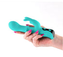 Hand holding the INYA Cyberluxe Rechargeable Silicone Rabbit Vibrator Aqua, showcasing its sleek design and functionality.