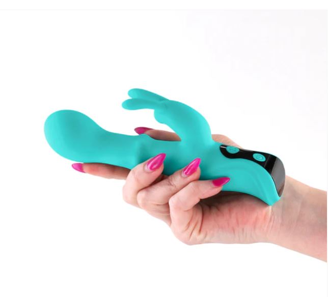 Hand holding the INYA Cyberluxe Rechargeable Silicone Rabbit Vibrator Aqua, showcasing its sleek design and functionality.