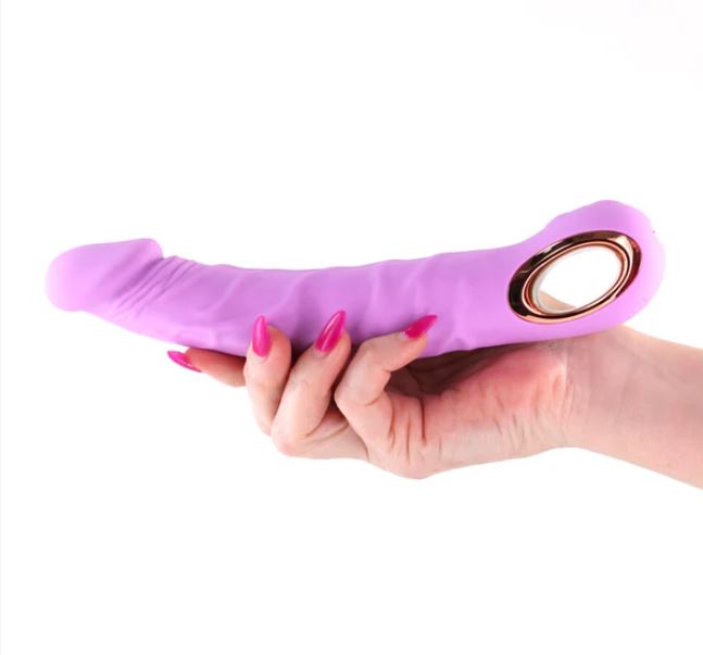 INYA Flex Rechargeable Silicone Flexible Vibrator Pink held in hand, showcasing its soft silicone and design.
