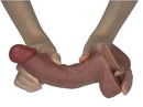 Real Skin Dual Layer Dildo 7.5 inch Light Brown held in hands, showcasing realistic texture and flexible design.