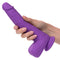 Gyrating & Thrusting Silicone Stud in purple held in hand, rechargeable vibrator by CalExotics for intense pleasure and sensation.