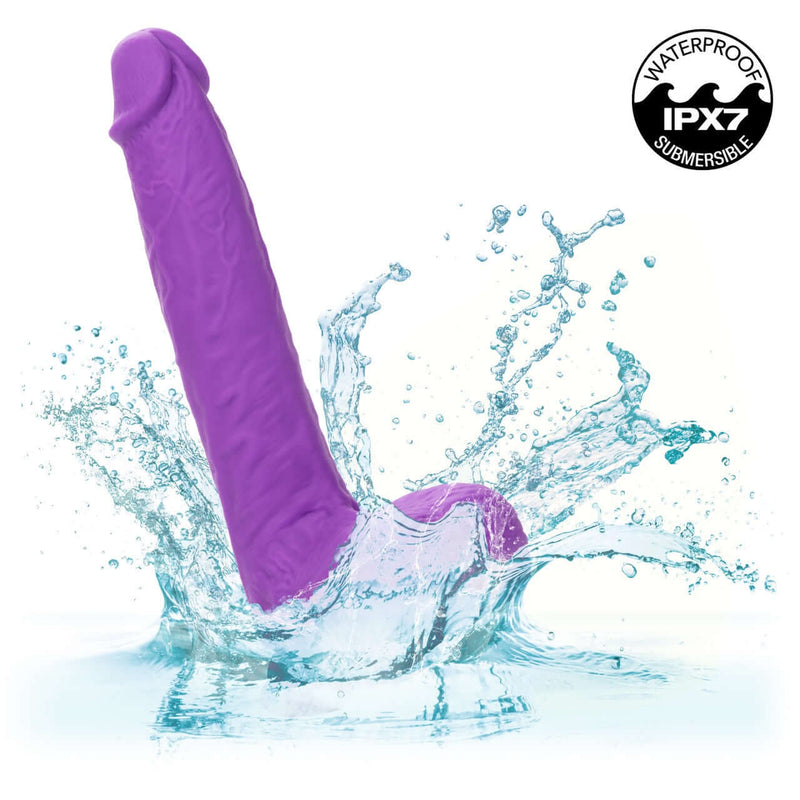 Rechargeable Gyrating & Thrusting Silicone Studs from CalExotics splashing into water, showcasing intense pleasure and waterproof design.
