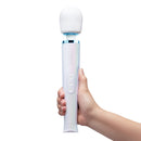 Le Wand Dive Submersible Vibrating Massager Seashell held in hand, showcasing its sleek design and button controls.