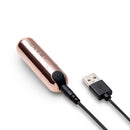 Le Wand Essentials Mini Rose Gold Bullet Vibrator connected to USB for charging.