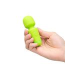 Le Wand Essentials Mini Wand Vibe Pocket-sized Vibrator held in a hand, showcasing its compact design.