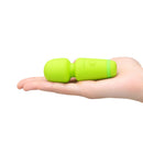 Le Wand Essentials Mini Wand Vibe Pocket-sized Vibrator in hand for easy portability.