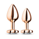 B-vibe Essentials 2-piece Jewel Hearts Anal Training Set featuring two sparkling plugs with heart-shaped jewel bases.