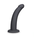 B-vibe Essentials 7 Inch Smooth Silicone Dildo Black on a white background