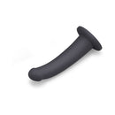 B-vibe Essentials 7 Inch Smooth Silicone Dildo Black on a white background showcasing its sleek design.