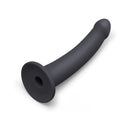 B-vibe Essentials 7 Inch Smooth Silicone Dildo Black on a white background, highlighting its sleek design.