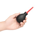 b-Vibe Essentials Mini Travel Enema Set 30 ml in hand showing portable anal douche for hygiene.