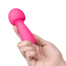 Together Spark On The Go Mini Wand Vibrator held in hand, showcasing its compact design and vibrant pink color.