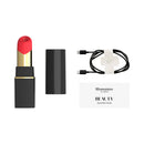 Womanizer Beauty Clitoral Air Pulse Stimulator Black Gold with charging cable and quick start guide.