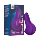 We-Vibe Shared Touch Couples Grinding Vibrator Purple displayed with packaging for dual pleasure.