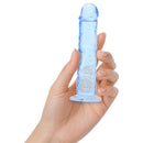 Realrock Realistic Dildo 5 Inch Blue held in hand, showcasing its crystal-clear blue finish.