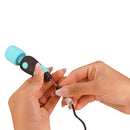 Hand holding PalmPower Pocket Mini Massager Teal while connecting the charger cable.