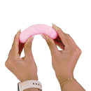 Softies Dual Layer Bullet Vibrator 4 Inch Pink being held, showcasing its soft silicone texture and flexible design.