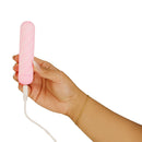 Softies Dual Layer Bullet Vibrator 4 Inch Pink being held, showcasing its sleek design and charging cable.
