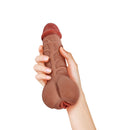 Adam & Eve The Beefmaster 2-in-1 Enhancer Stroker held in hand, showcasing its realistic design and dual-purpose functionality.