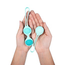 UVA Kegel Balls Progressive Weight Training Set held in hands for pelvic floor strengthening.