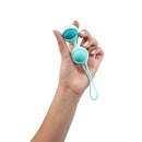 UVA Kegel Balls Progressive Weight Training Set held in hand, designed for strengthening pelvic floor muscles.