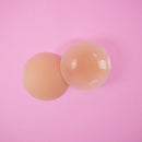 UVA Caramel Non-Adhesive Round Nipple Covers displayed on a pink background for a smooth, natural look.