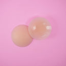 UVA Vanilla Non-Adhesive Round Nipple Covers on a pink background, featuring soft silicone design.