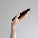 Person holding the Chakrubs Xaga Slim Non-Phallic Dildo against a neutral background.