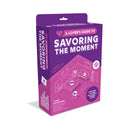 A Lover's Guide To Savoring The Moment Oral Play Kit packaging showcasing intimate exploration and pleasure.