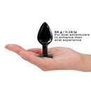 Dorcel Diamond Medium Butt Plug Black held in hand, showcasing its sleek design and lightweight material.
