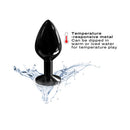 Dorcel Diamond Medium Butt Plug Black showcased in water splash, highlighting its temperature-responsive features.