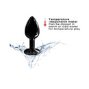 Dorcel Diamond Small Metal Anal Plug Black on water, showcasing its temperature-responsive features.