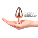 Dorcel Diamond Butt Plug Rose Gold Large held in hand displaying its polished finish and size suitable for experienced users.
