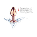 Dorcel Diamond Butt Plug Rose Gold Small on water splash background, showcasing its elegant design and temperature-responsive metal.