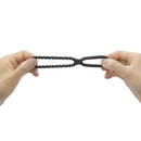 Dorcel Dual Ring Double Cock Ring held in hands showcasing its innovative design for enhanced pleasure.