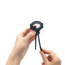Dorcel Fit Ring Cock Ring for Men held in hands, showcasing its sleek design and functionality for enhanced sensations.